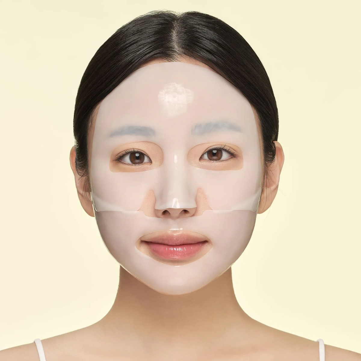 Masque hydrogel en deux parties posé sur le visage