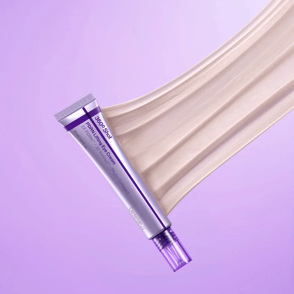 Tube de contour des yeux posé sur une trace de crème beige rosé
