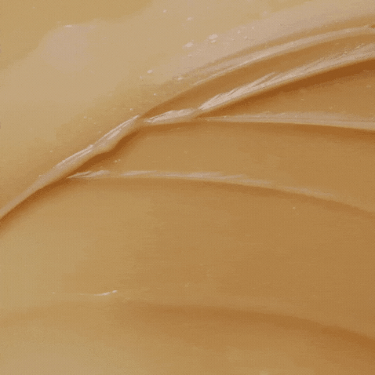 Texture de gel doré étalée en bandes