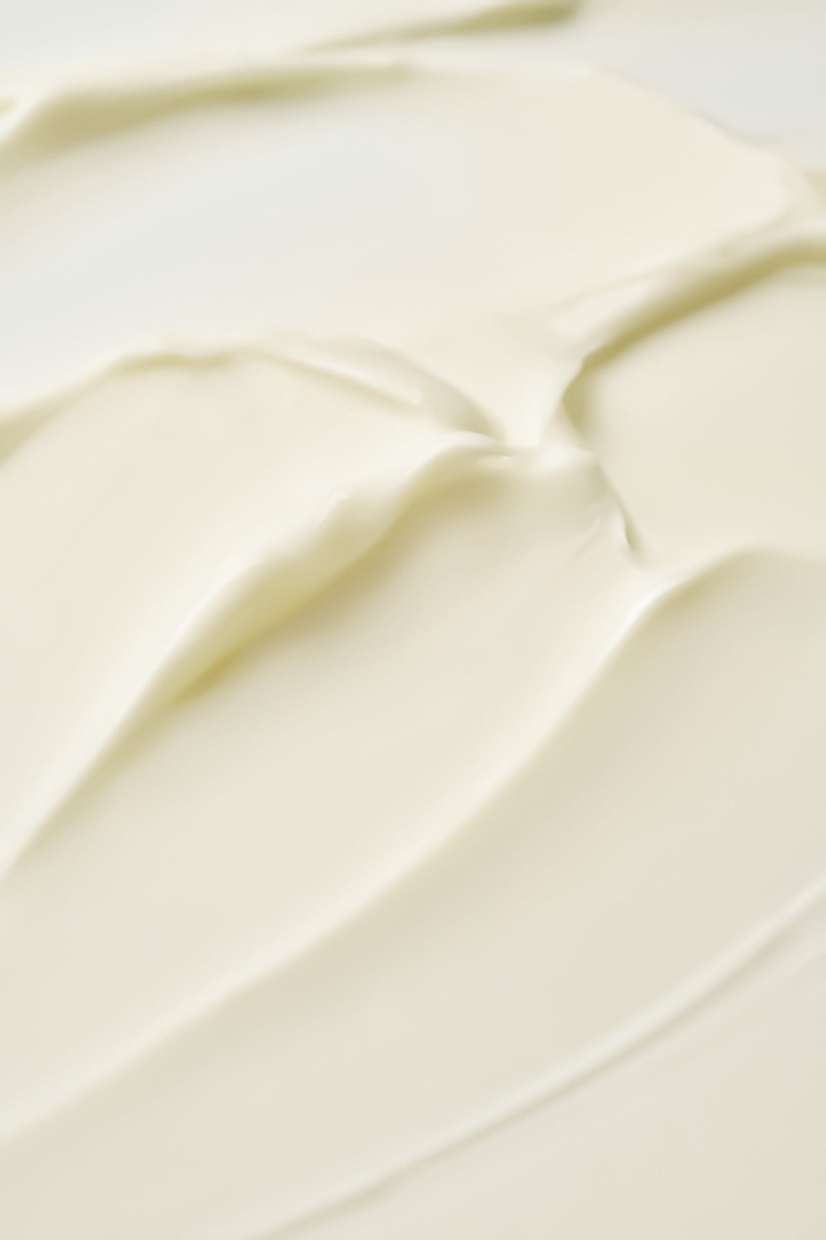Texture de crème ivoire étalée en bandes