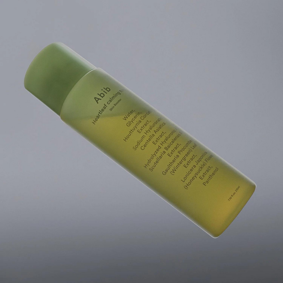 Flacon vert de lotion avec sa liste d&