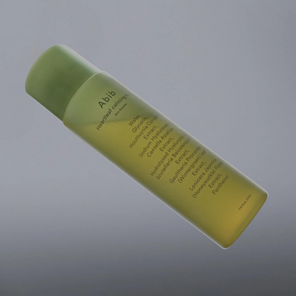Flacon vert de lotion avec sa liste d&