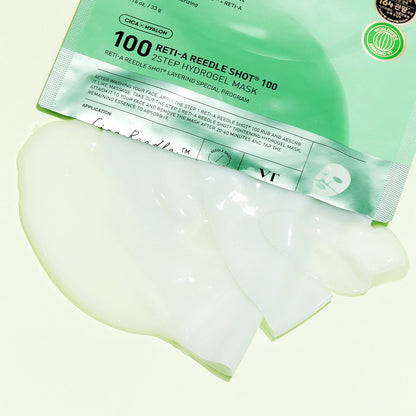 Masque hydrogel vert pâle plié à côté de son sachet