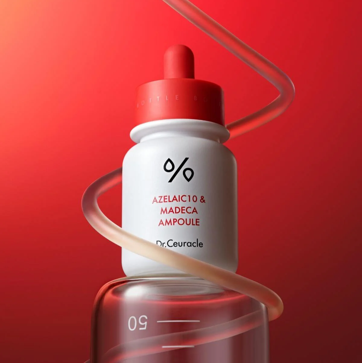 Flacon blanc à compte-gouttes rouge entouré d&