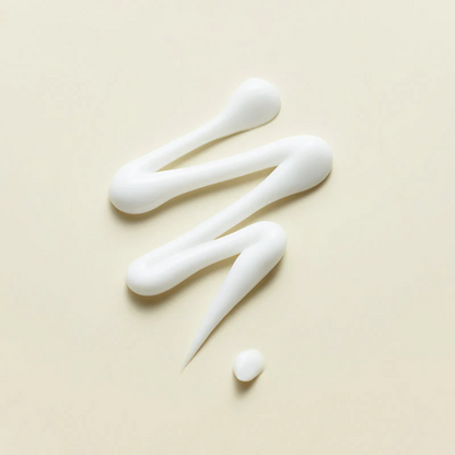 Ruban de crème blanche en zigzag sur fond beige