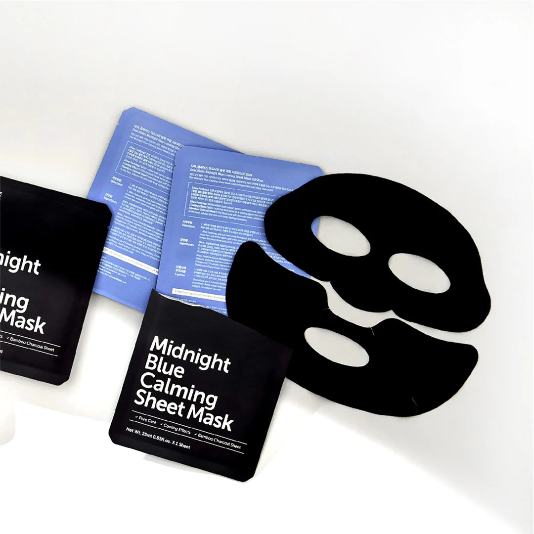 Masque noir en deux parties déplié près de ses sachets