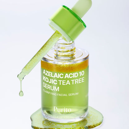 Flacon de sérum vert ouvert avec sa pipette et des particules jaunes