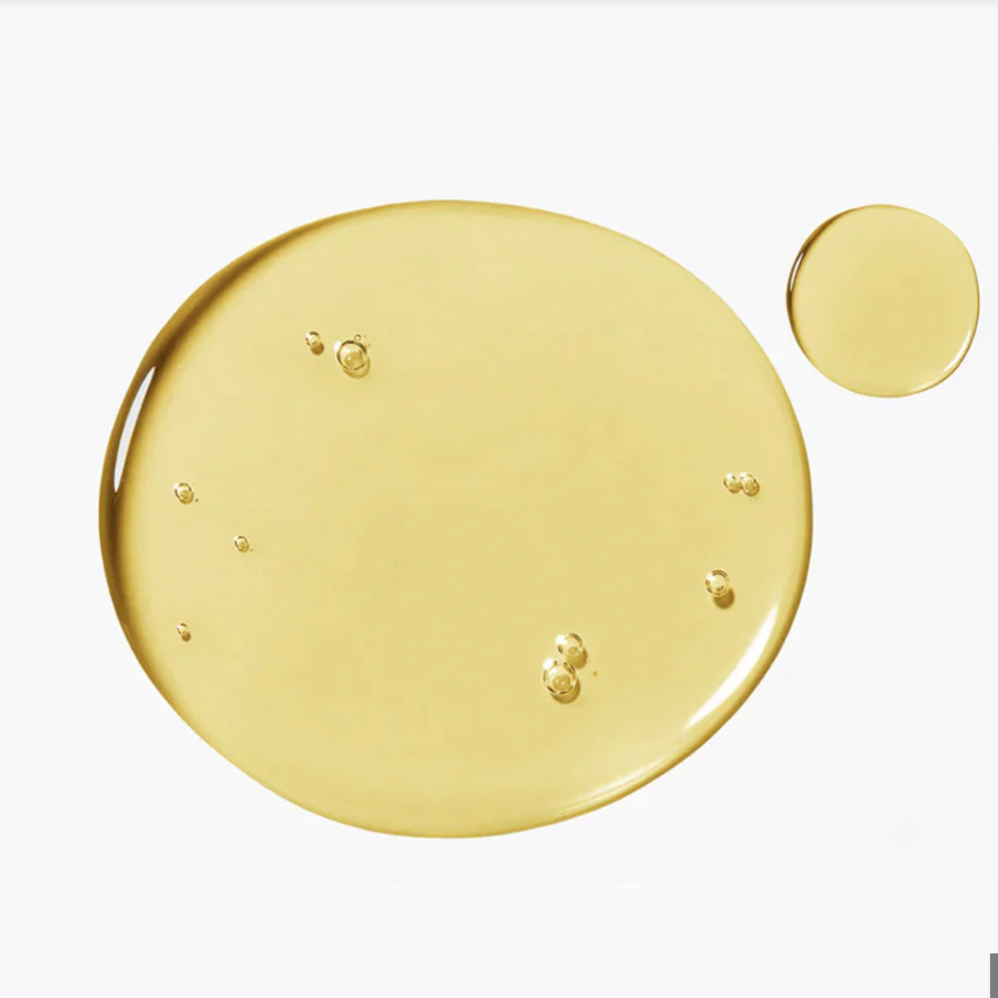Deux gouttes rondes de sérum jaune à petites bulles