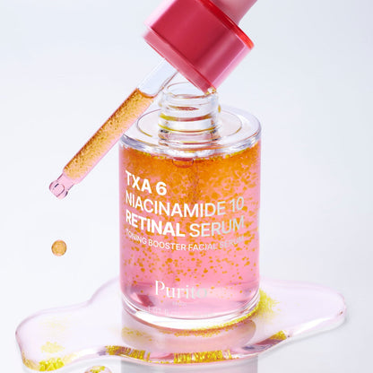 Flacon rose ouvert avec sa pipette et des particules jaunes dans le sérum