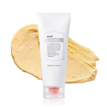 Tube de nettoyant-masque devant une trace de pâte dorée