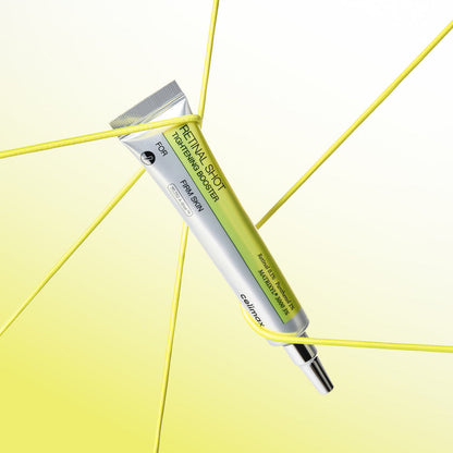 Tube argenté de booster retenu par des fils jaunes