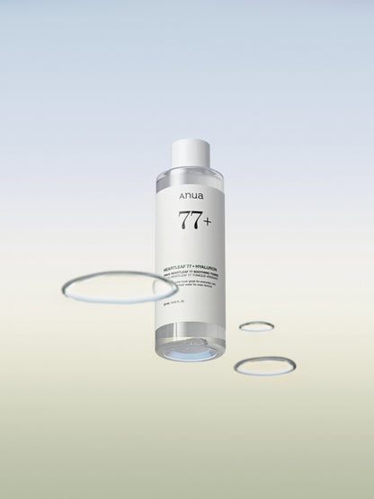 Flacon transparent de lotion entouré de gouttes d&