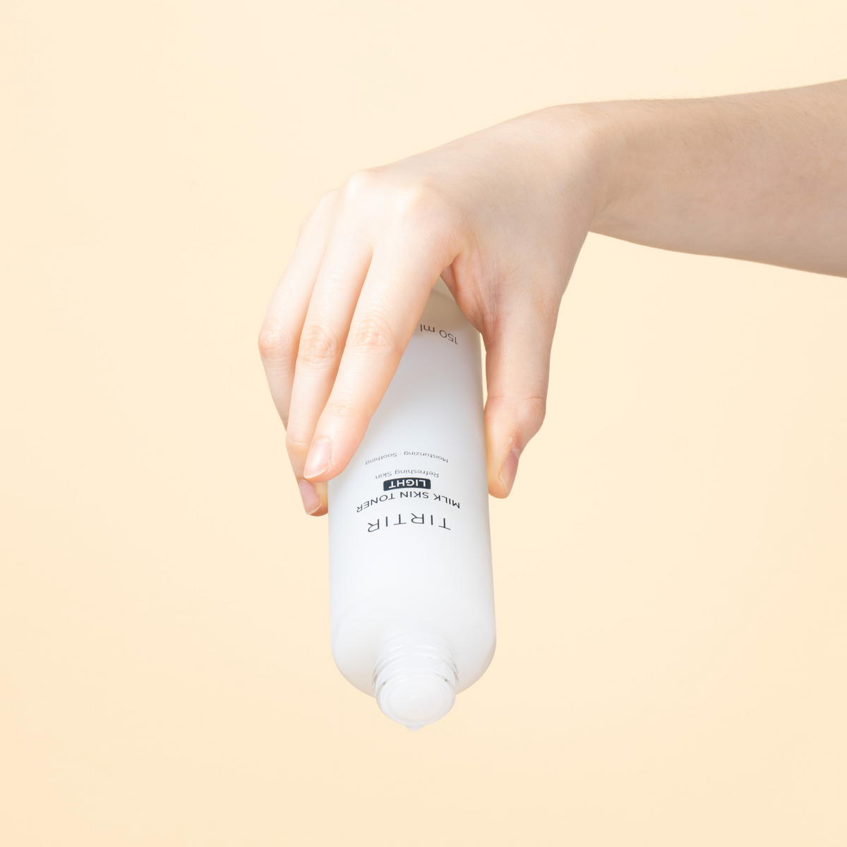 Flacon de lotion Light ouvert et incliné vers le bas