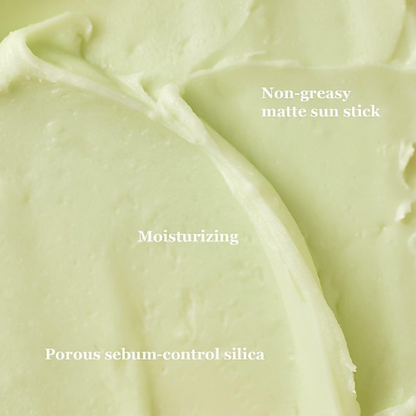 Texture verte du stick, avec les mentions fini mat, hydratation et silice absorbante