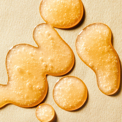 Gouttes ambrées de texture à fines bulles