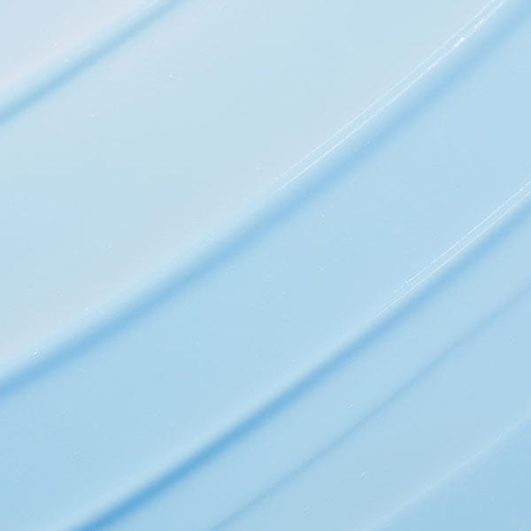 Texture de crème bleu clair étalée en larges bandes