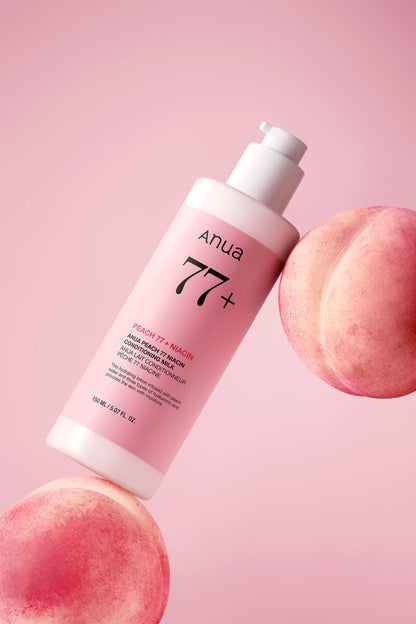 Flacon-pompe rose de 250 ml présenté entre des pêches