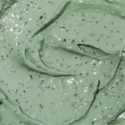 Texture épaisse du masque vert parsemé de particules sombres
