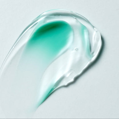 Texture de gel transparent mêlé à une trace de crème verte