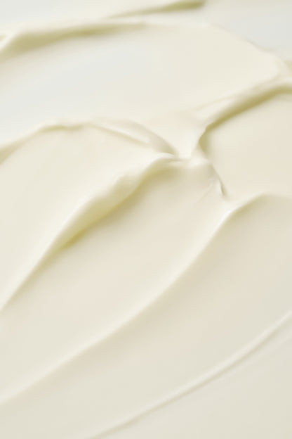 Texture de crème ivoire étalée en bandes